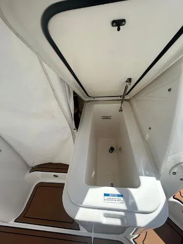Slide: The Image of 2019 Pursuit OS 385 Offshore boat interior storage compartment. - 17