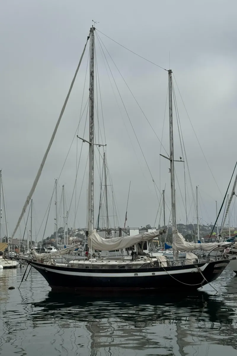 Slide: The Image of 1979 Cheoy Lee Bill Luders Clipper Ketch sailboat docked in a marina. - 3