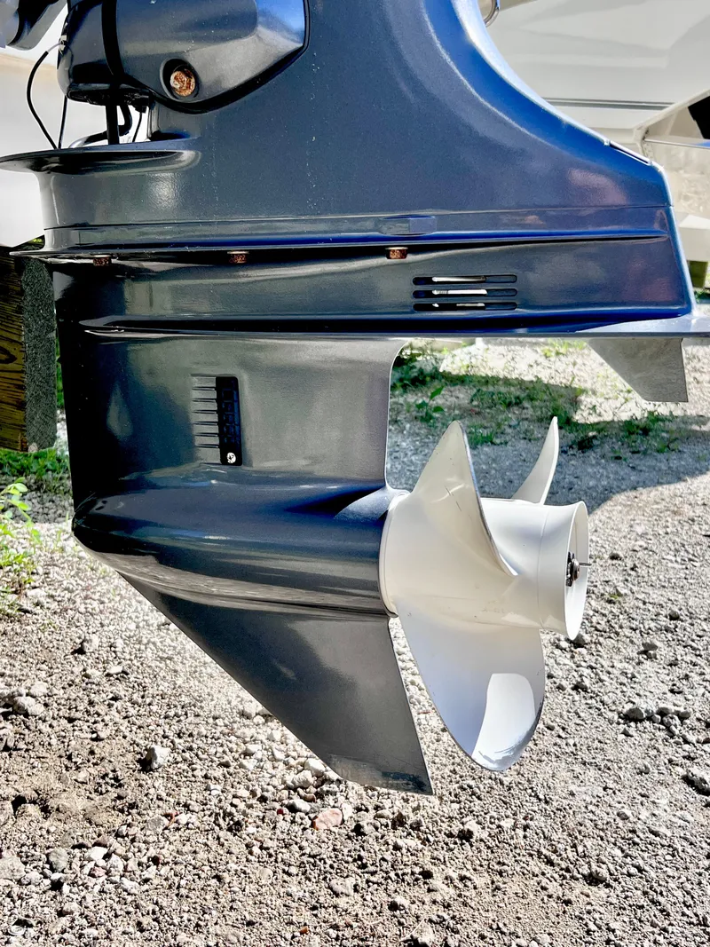 Slide: The Image of 2017 Stingray 182 SC boat motor and propeller on gravel surface. - 16