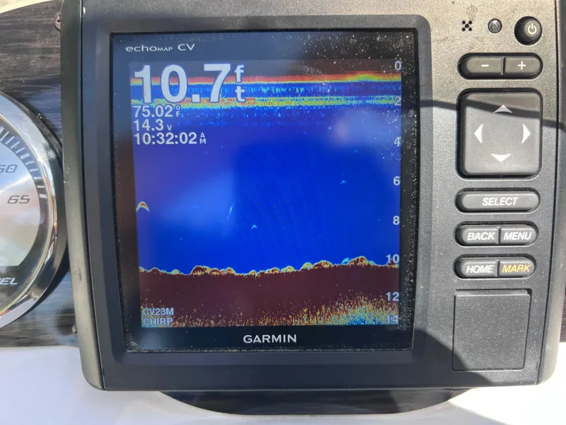 Slide: The Image of Garmin fishfinder display on 2017 Stingray 182 SC, showing depth and water temperature. - 21