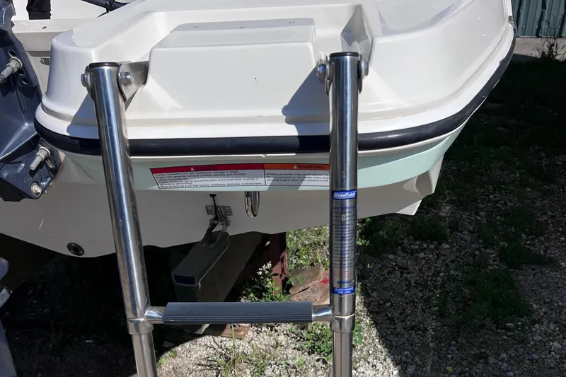 Slide: The Image of 2017 Stingray 182 SC boat with stainless steel swim ladder. - 26