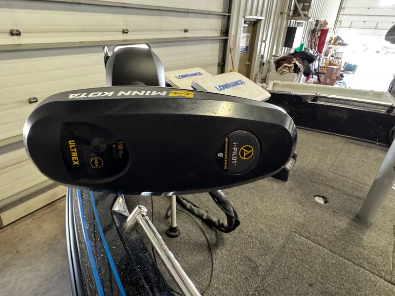 Slide: The Image of Open storage compartment in 2022 Nitro ZV21 boat, featuring a blue interior. - 15