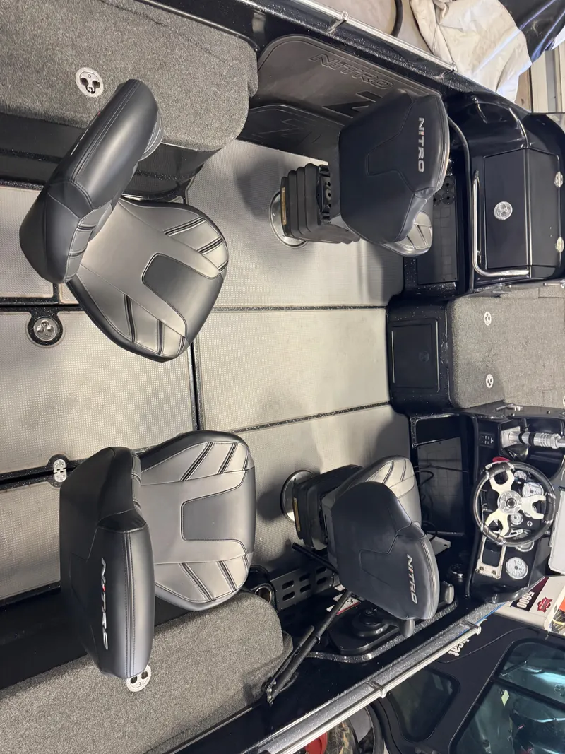 Slide: The Image of Interior of a 2022 Nitro ZV21 boat showing storage compartment and seating area. - 18