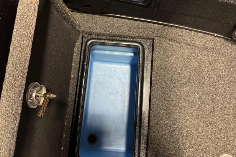 Slide: The Image of Interior compartment of a 2022 Nitro ZV21 boat, featuring a blue storage area. - 19