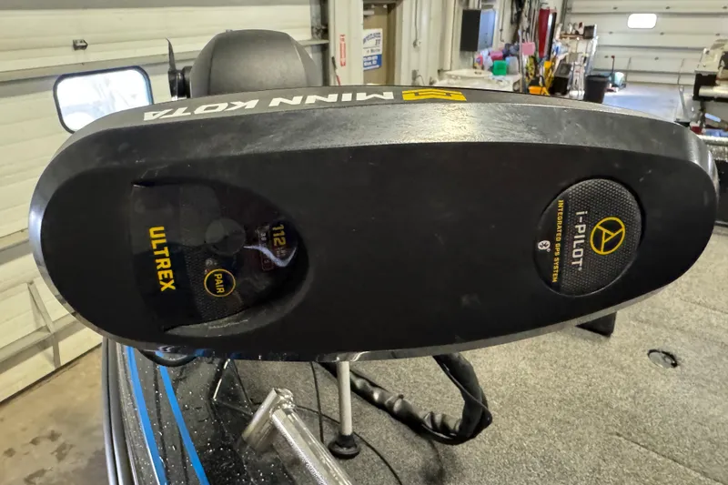 Slide: The Image of Minn Kota Ultrex motor on 2022 Nitro ZV21 boat in a garage setting. - 23