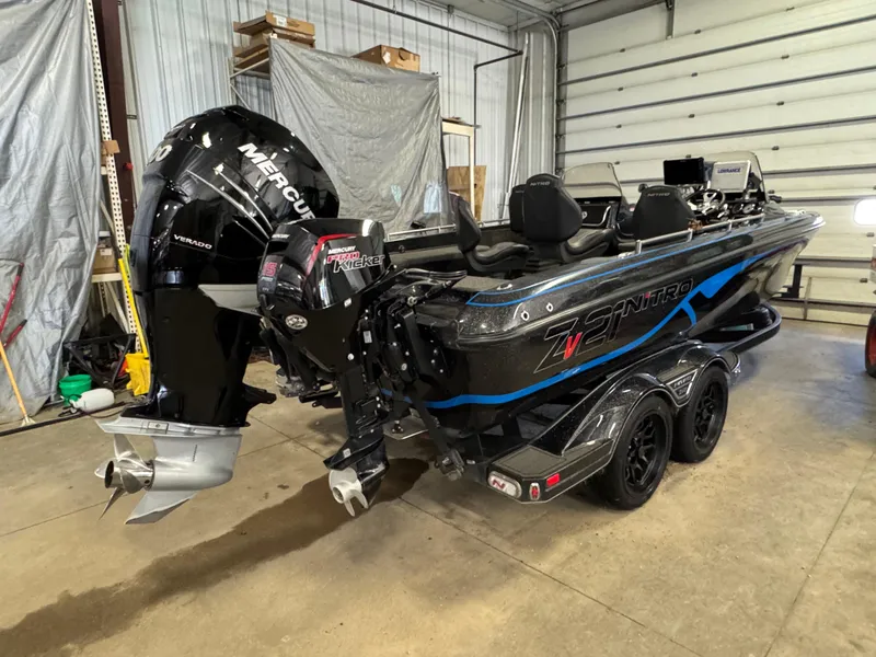 Slide: The Image of 2022 Nitro ZV21 boat with Mercury Verado engine in a garage setting. - 4