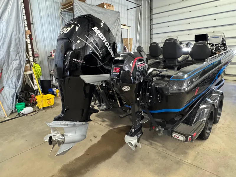 Slide: The Image of 2022 Nitro ZV21 boat in a garage, featuring sleek design and dual-axle trailer. - 5