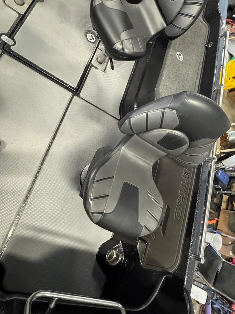 Slide: The Image of 2022 Nitro ZV21 boat interior with two cushioned seats and storage compartments. - 7