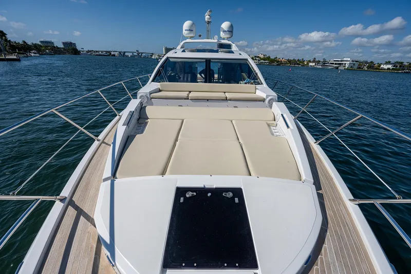Slide: The Image of Azimut 55S 2014 yacht on water, featuring spacious deck and luxurious seating. - 11