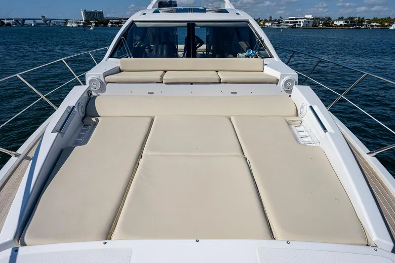 Slide: The Image of 2014 Azimut 55S yacht with spacious sunbathing deck on calm waters. - 12