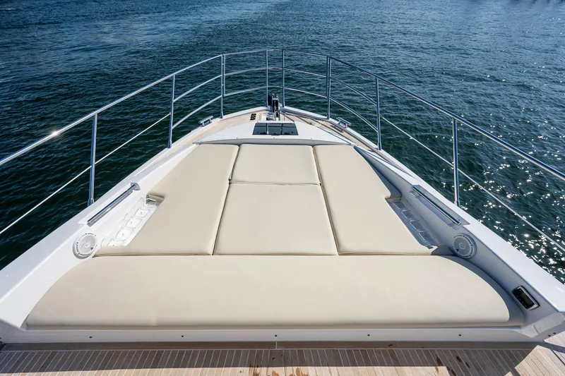 Slide: The Image of 2014 Azimut 55S yacht with spacious sunbathing deck on calm water. - 14