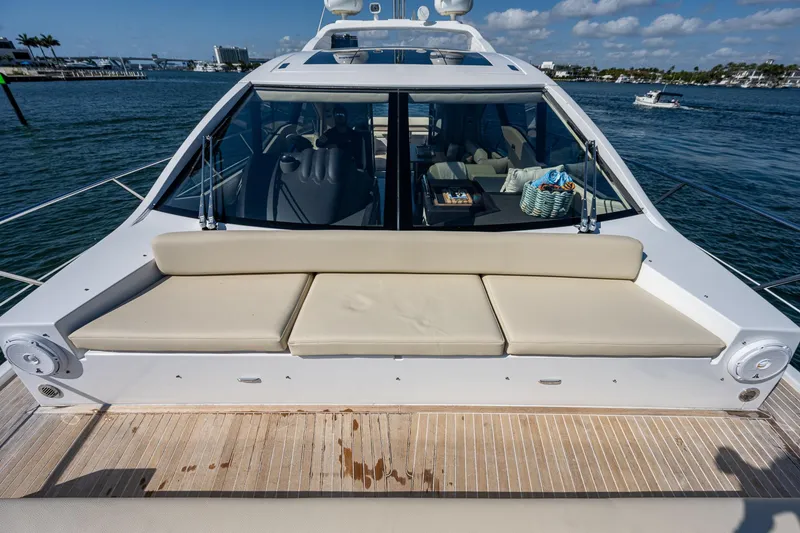 Slide: The Image of 2014 Azimut 55S yacht with beige seating, docked on a sunny day. - 15