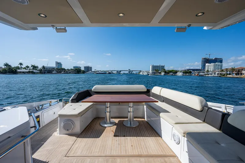Slide: The Image of Luxury Azimut 55S yacht deck with seating, table, and scenic waterfront view, 2014 model. - 20