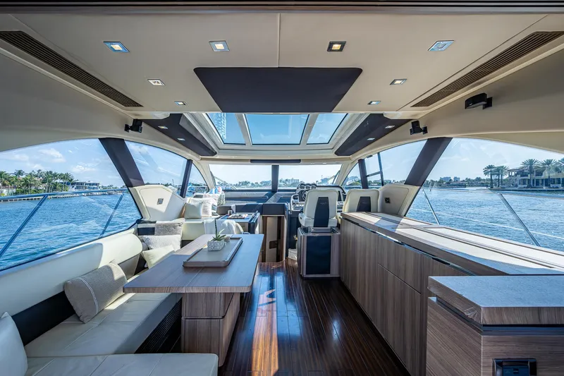 Slide: The Image of Luxurious interior of a 2014 Azimut 55S yacht with panoramic windows and elegant furnishings. - 27
