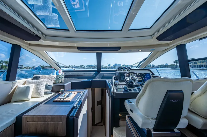 Slide: The Image of Interior view of 2014 Azimut 55S yacht with luxurious seating and panoramic windows. - 31
