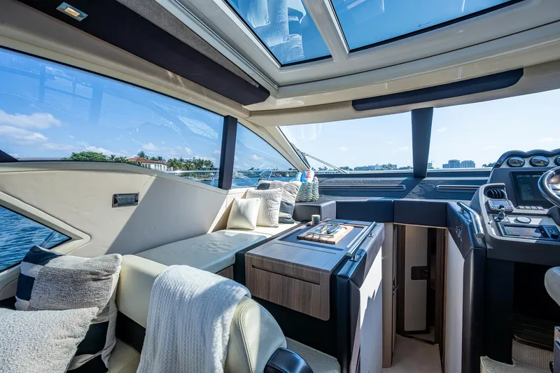 Slide: The Image of Luxurious interior of a 2014 Azimut 55S yacht with panoramic windows and elegant seating. - 33