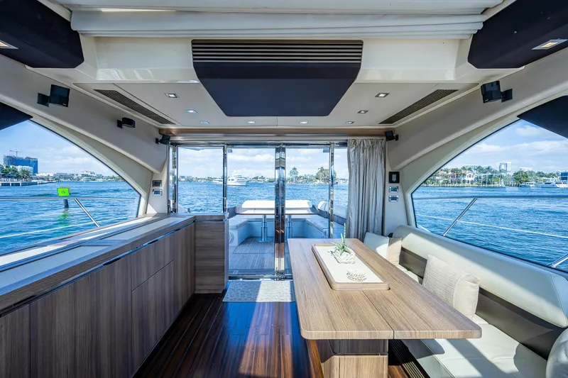 Slide: The Image of Luxurious interior of 2014 Azimut 55S yacht with elegant dining area and scenic ocean view. - 34