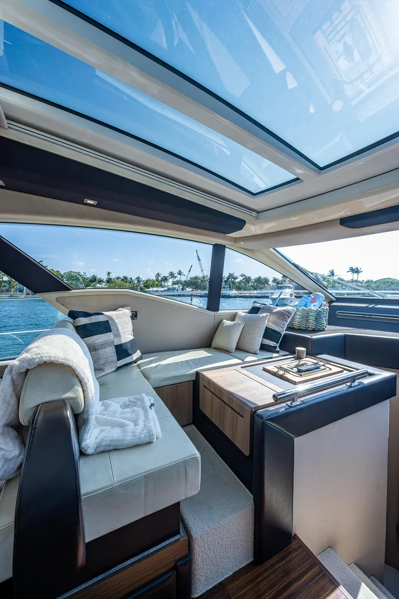 Slide: The Image of Luxurious interior of a 2014 Azimut 55S yacht with panoramic windows and elegant seating. - 35