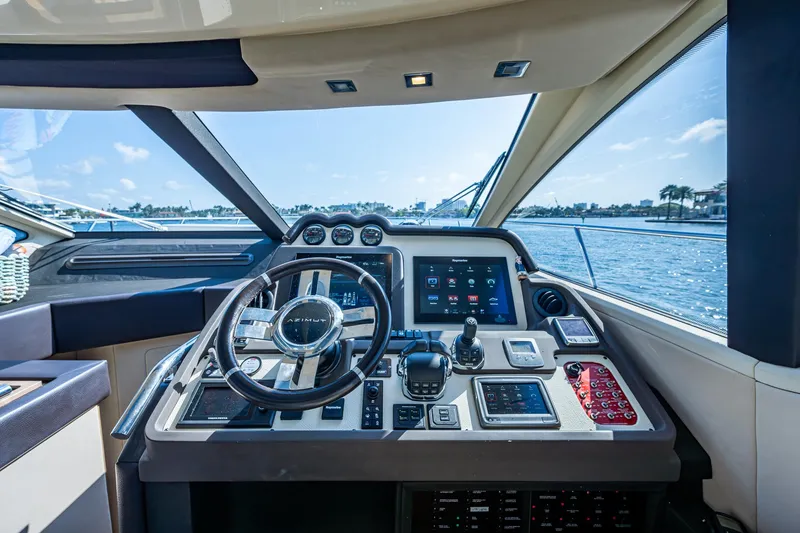 Slide: The Image of Cockpit of 2014 Azimut 55S yacht with modern controls and scenic water view. - 37