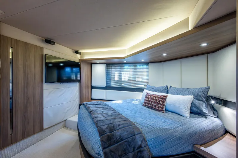 Slide: The Image of Luxurious bedroom interior of a 2014 Azimut 55S yacht with modern design and cozy bedding. - 38