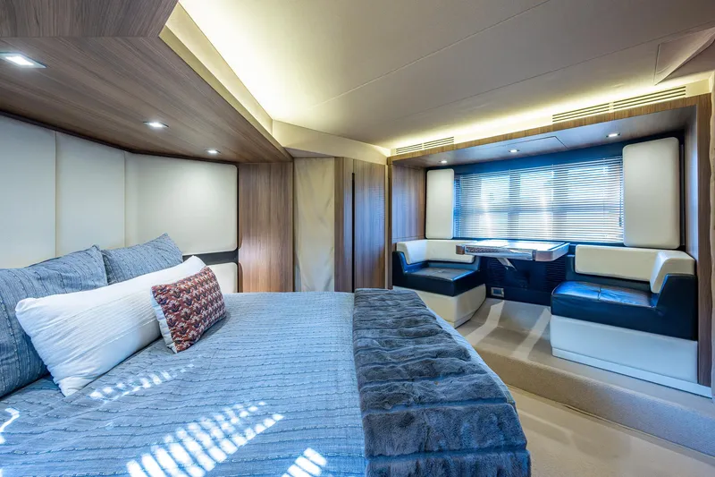 Slide: The Image of Luxurious interior of a 2014 Azimut 55S yacht with elegant bedroom and seating area. - 40