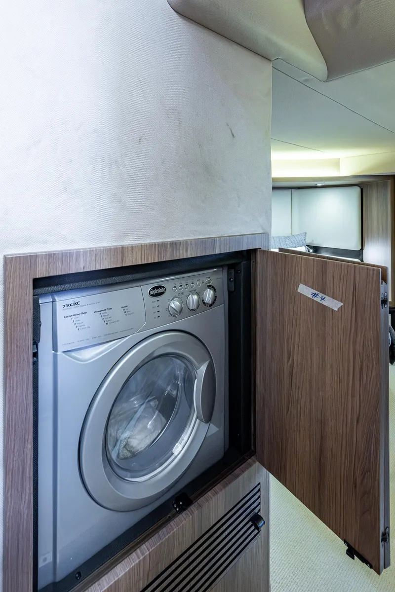 Slide: The Image of 2014 Azimut 55S yacht interior with built-in washing machine. - 43