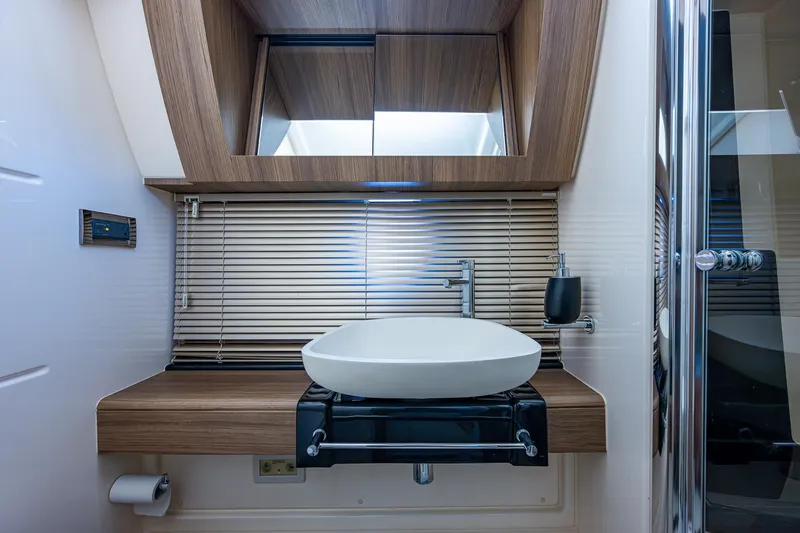 Slide: The Image of Luxurious bathroom interior of 2014 Azimut 55S yacht with modern sink and wooden accents. - 44