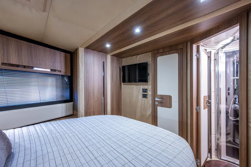 Slide: The Image of Luxurious interior of 2014 Azimut 55S yacht with modern bedroom and ensuite bathroom. - 49
