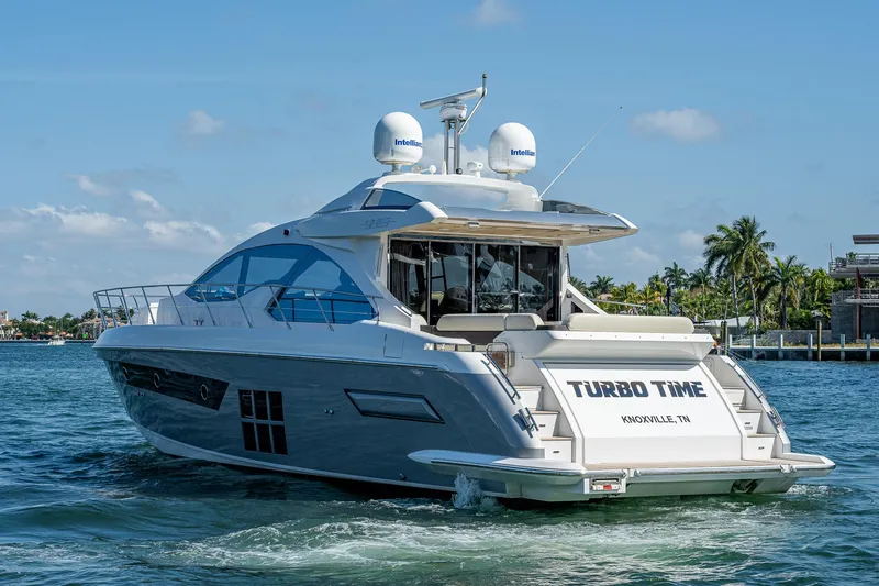 Slide: The Image of 2014 Azimut 55S yacht cruising on water, featuring sleek design and modern amenities. - 8