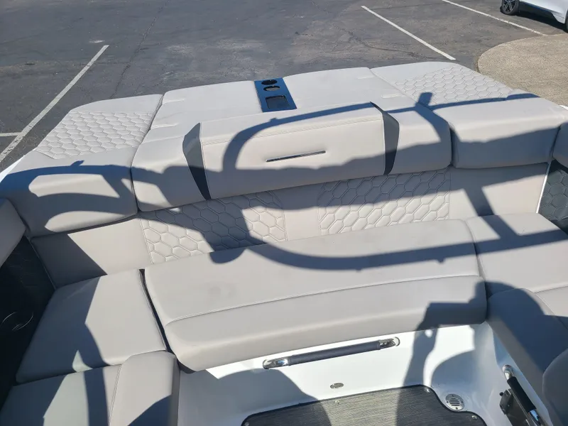 Slide: The Image of 2023 Four Winns H2 boat interior with cushioned seating and modern design. - 13