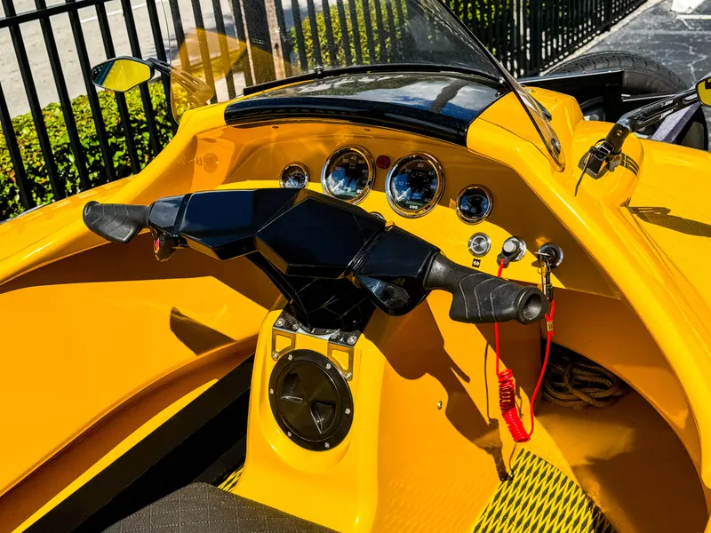 Slide: The Image of 2024 Airboat Airslide A33 dashboard with yellow interior and modern controls. - 6