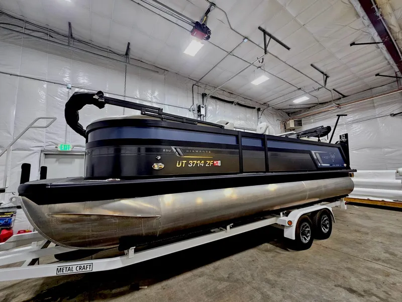 Slide: The Image of 2023 Viaggio Diamante U pontoon boat on trailer in indoor storage facility. - 0