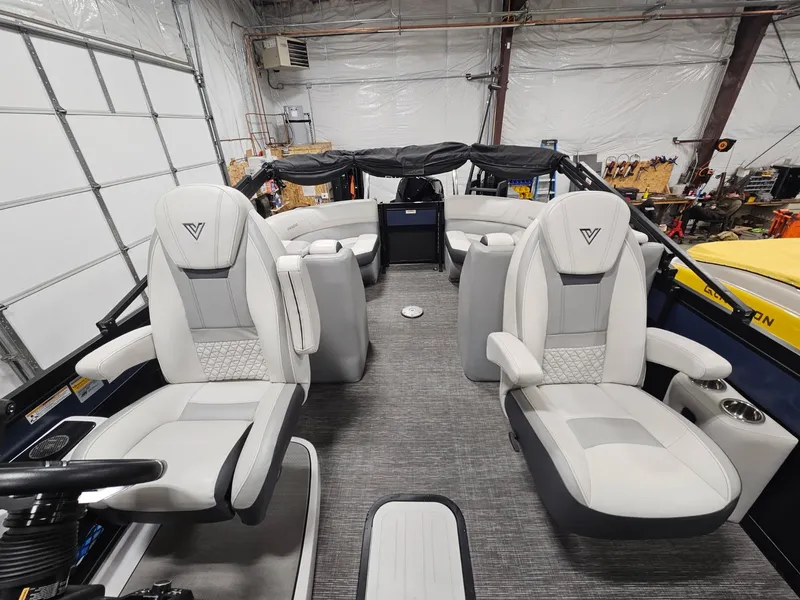 Slide: The Image of 2023 Viaggio Diamante U boat interior with luxurious seating in a spacious garage. - 10