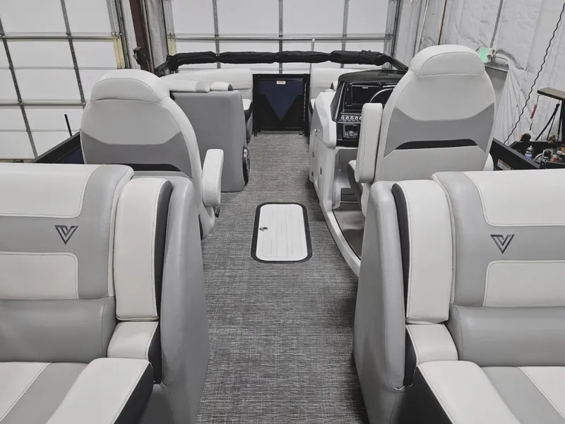 Slide: The Image of 2023 Viaggio Diamante U boat interior with gray and white seating in a garage. - 11