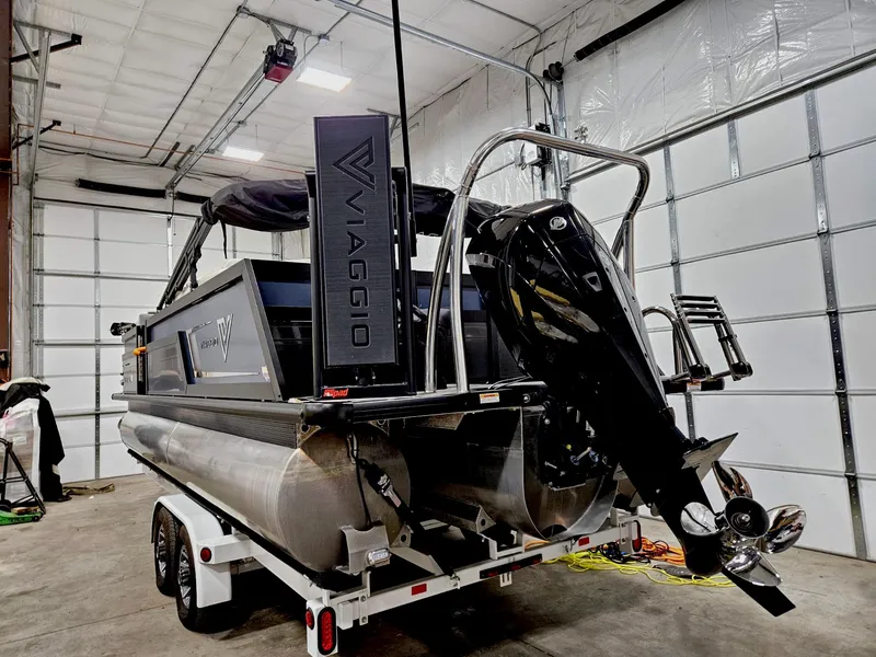 Slide: The Image of 2023 Viaggio Diamante U pontoon boat on trailer in a garage. - 4