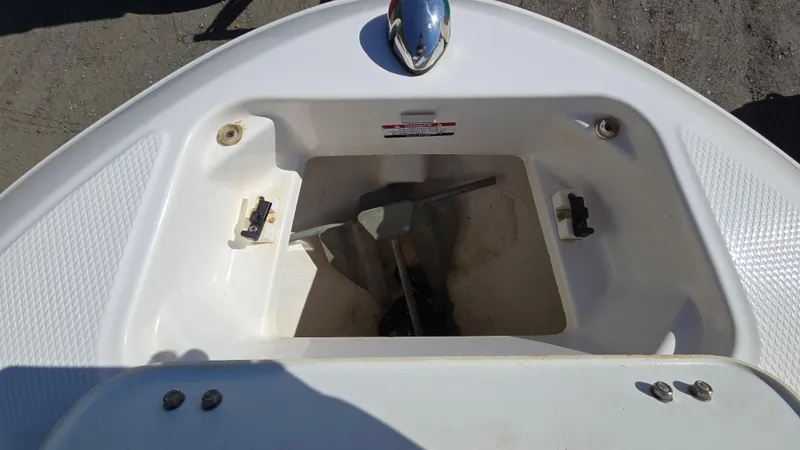 Slide: The Image of 2019 Chaparral 21 H2O Sport boat anchor storage compartment. - 22