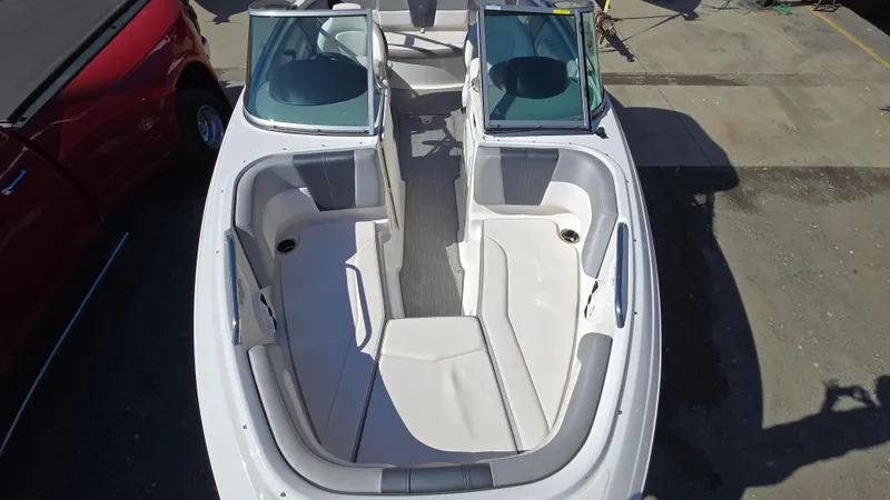 Slide: The Image of 2019 Chaparral 21 H2O Sport boat interior, featuring spacious seating and sleek design. - 23