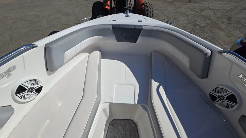 Slide: The Image of 2019 Chaparral 21 H2O Sport boat interior with seating and speakers. - 27