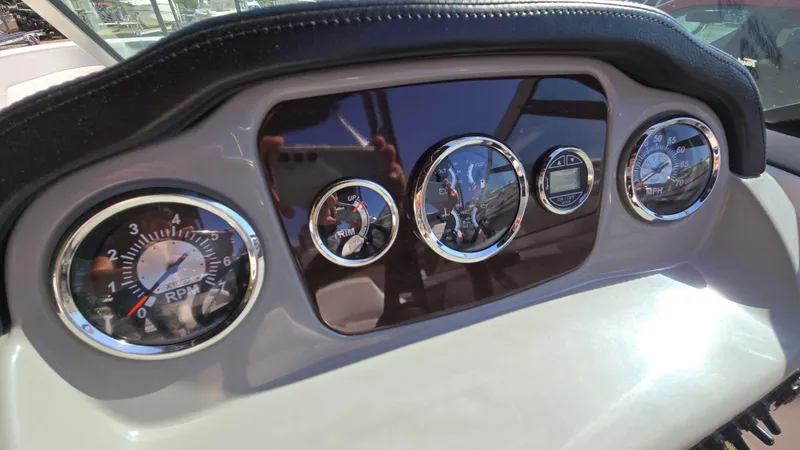 Slide: The Image of Dashboard of 2019 Chaparral 21 H2O Sport boat with gauges and controls. - 34