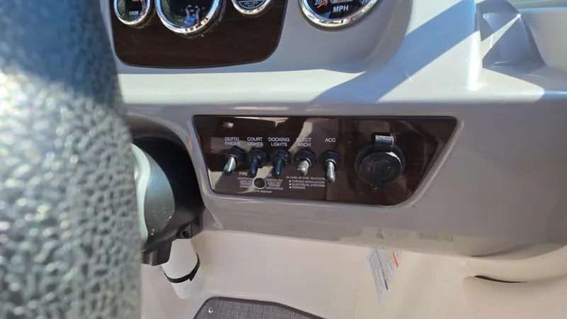 Slide: The Image of Dashboard controls of a 2019 Chaparral 21 H2O Sport boat. - 36