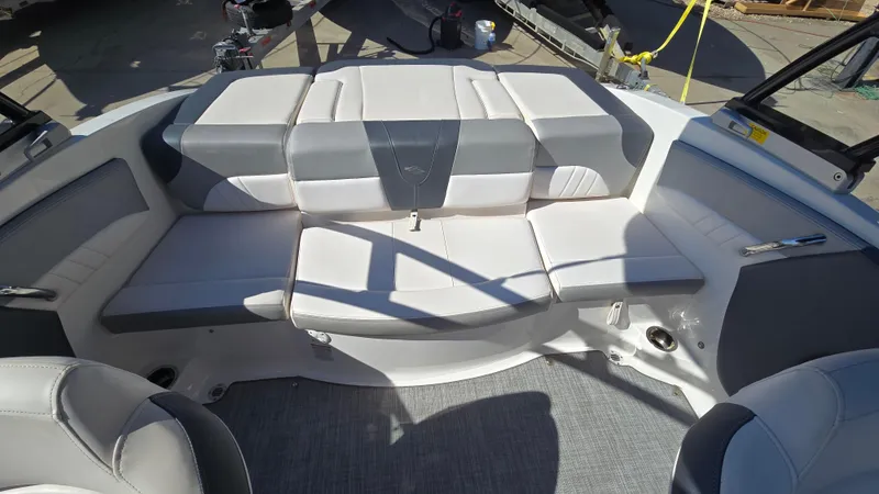 Slide: The Image of 2019 Chaparral 21 H2O Sport boat interior with gray and white seating. - 37