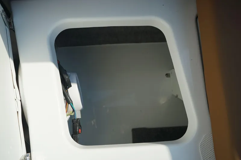 Slide: The Image of Storage compartment of 2023 Four Winns H2 Surf boat, interior view. - 20