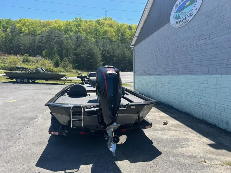 Slide: The Image of 2022 Vexus AVX1880 boat parked outside a marine shop on a sunny day. - 5