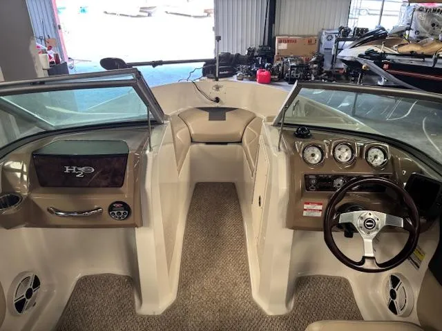 Slide: The Image of 2013 Chaparral 19 H2O Ski & Fish boat interior with steering wheel and dashboard. - 10