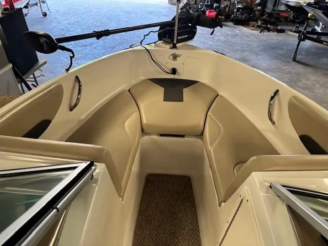 Slide: The Image of 2013 Chaparral 19 H2O Ski & Fish boat interior with seating and fishing equipment. - 11