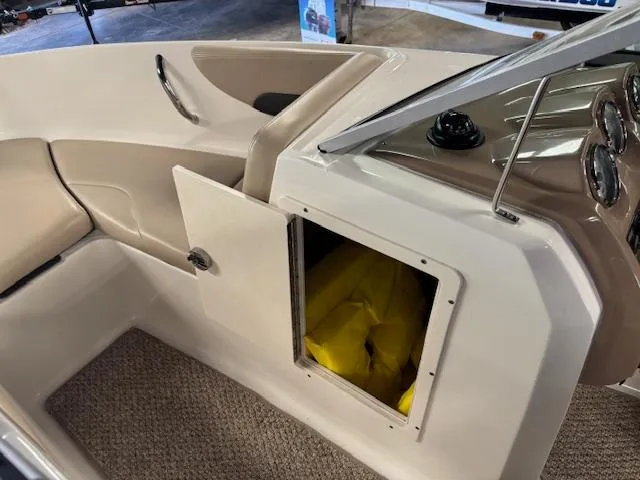 Slide: The Image of 2013 Chaparral 19 H2O Ski & Fish boat interior with open storage compartment. - 14