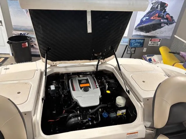 Slide: The Image of 2013 Chaparral 19 H2O Ski & Fish boat engine compartment, open hatch view. - 15
