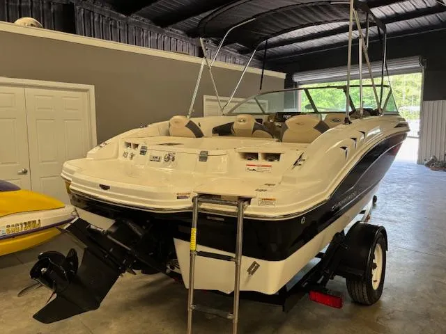 Slide: The Image of 2013 Chaparral 19 H2O Ski & Fish boat in a garage, rear view. - 3