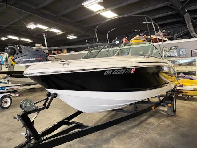 Slide: The Image of 2013 Chaparral 19 H2O Ski & Fish boat on trailer in indoor storage. - 5