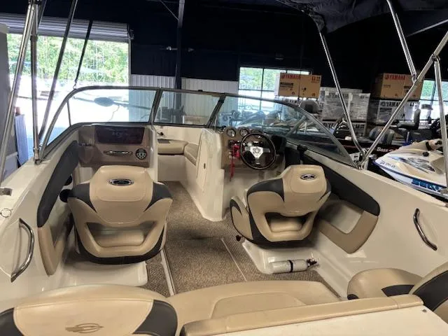 Slide: The Image of 2013 Chaparral 19 H2O Ski & Fish boat interior with seating and steering wheel. - 6